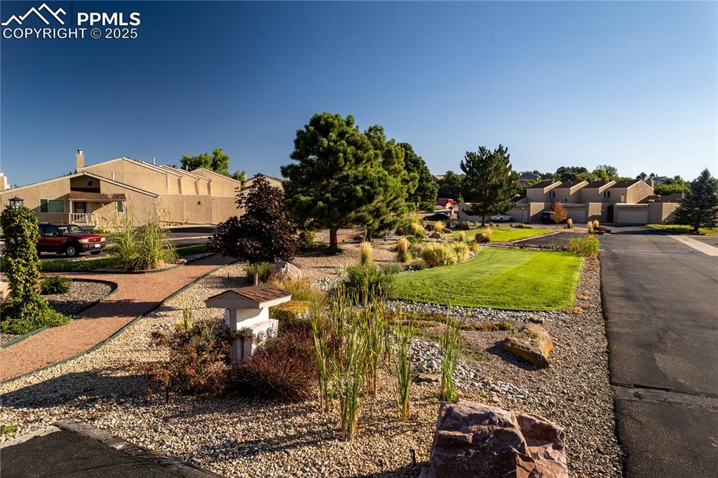 342 Mission Hill Way Colorado Springs, CO 80921 - Photo 8 of 37 a view of a house with a yard