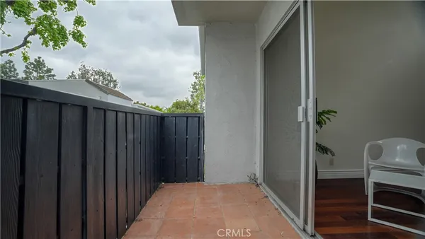 a balcony with wooden floor