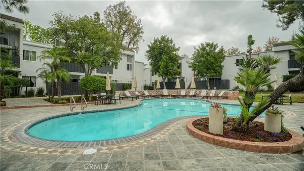 a view of a swimming pool with a sitting space