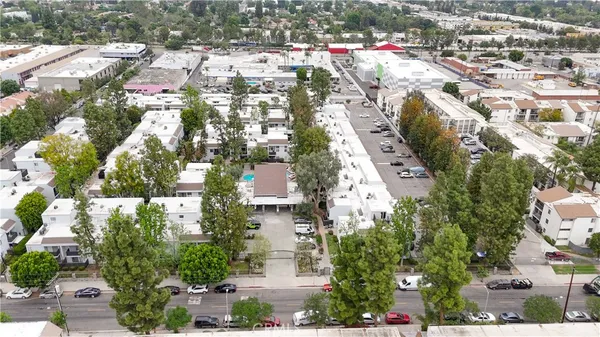 an aerial view of residential houses with outdoor space