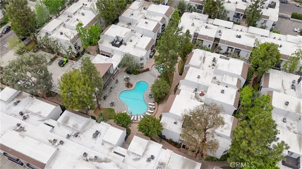 an aerial view of residential house with outdoor space