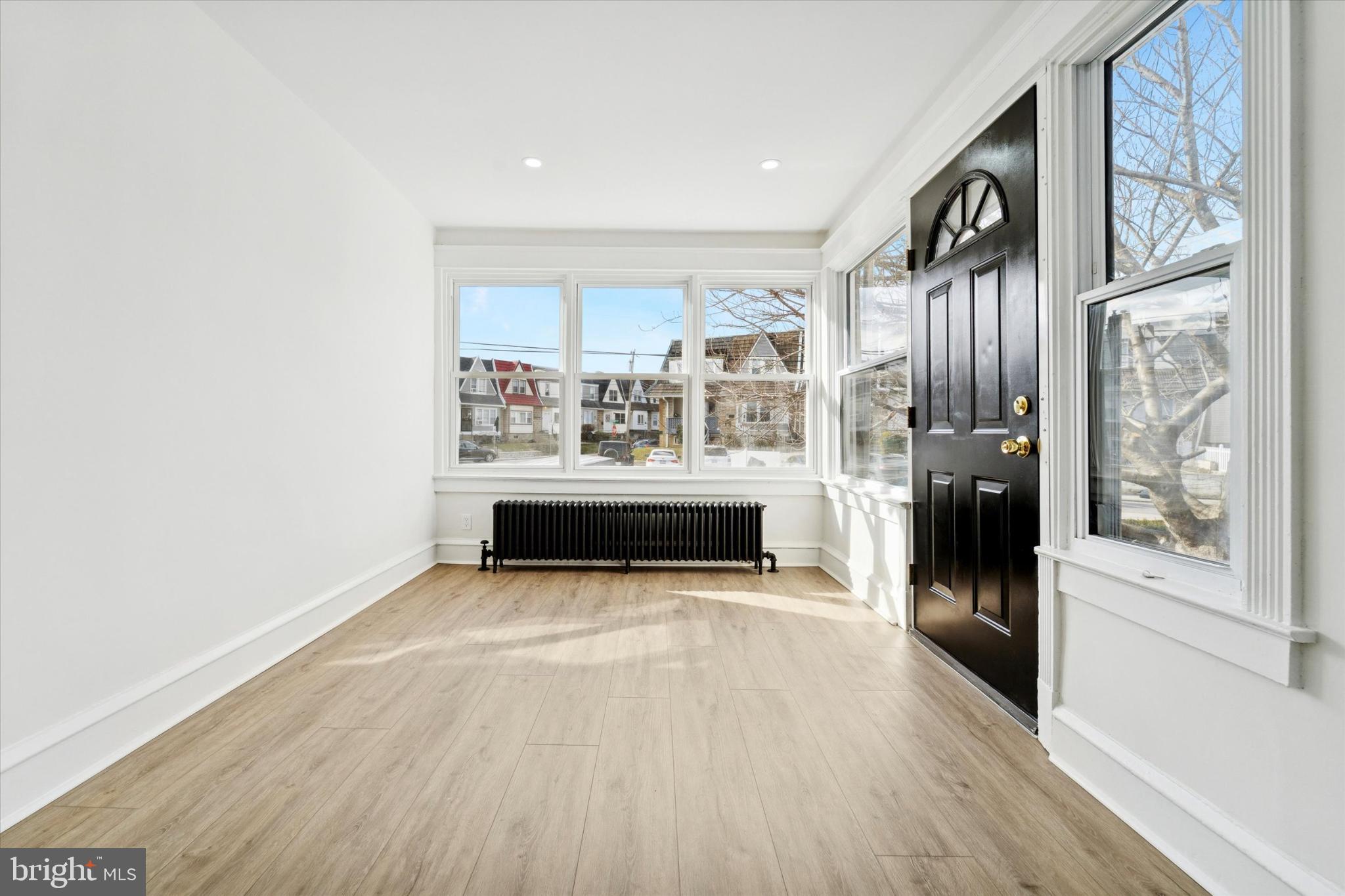 247 Coverly Road Lansdowne, PA 19050 - Photo 13 of 25 a view of a living room with furniture and wooden floor