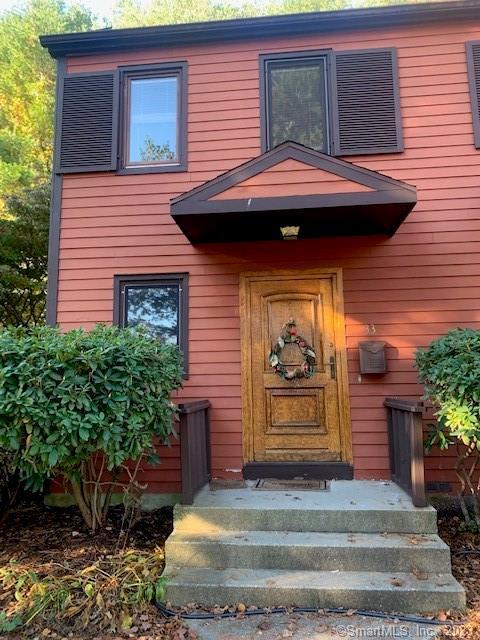 33 Courtland Drive, Unit 33 Groton, CT 06340 - Photo 1 of 14 a front view of a house with garden