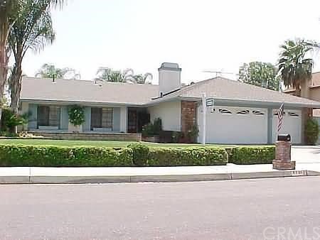 8326 Yearling Way Riverside, CA 92509 - Photo 1 of 1 a front view of a house with a yard