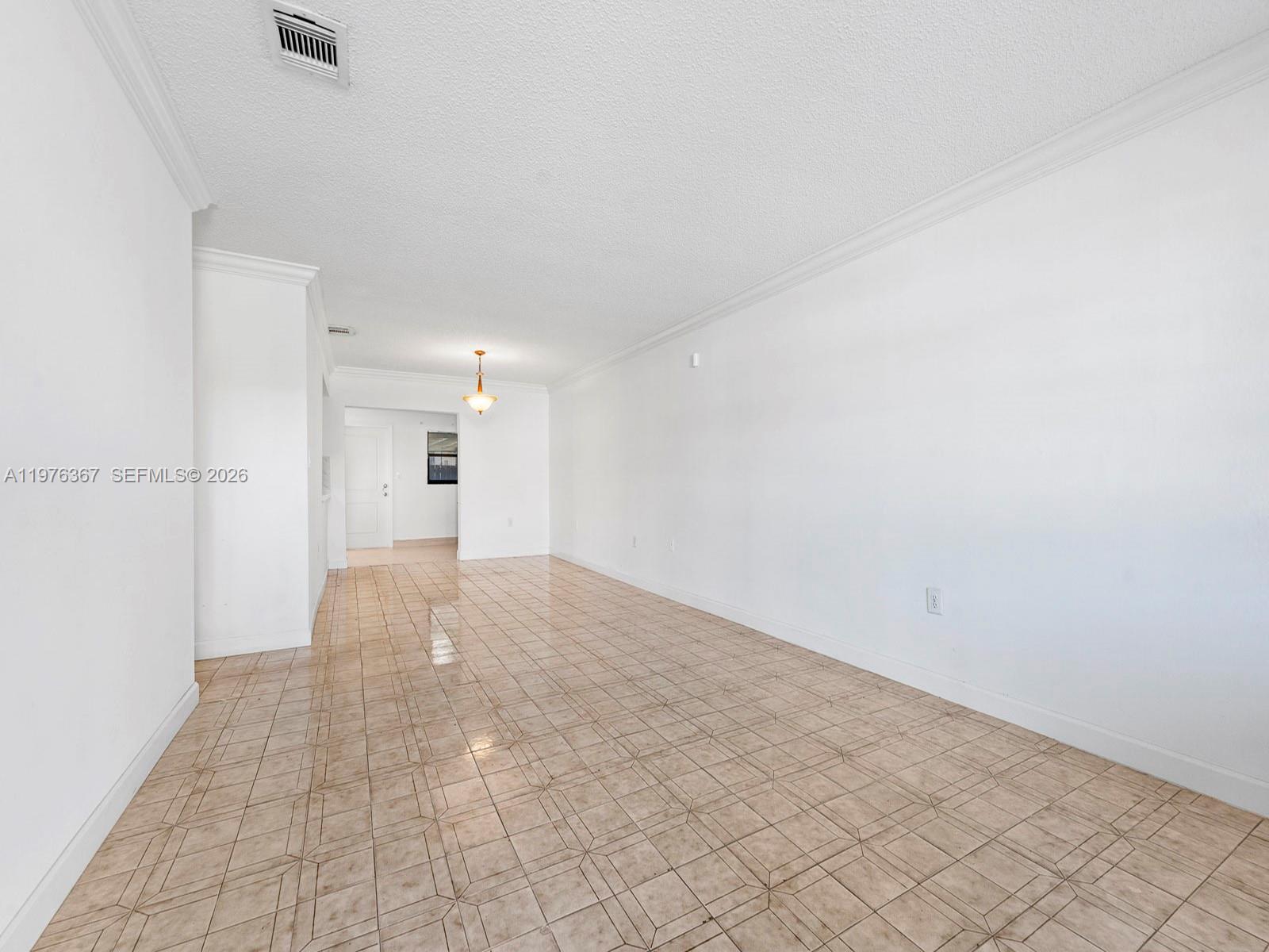 7121 Southwest 102nd Court Miami, FL 33173 - Photo 2 of 33 a view of an empty room