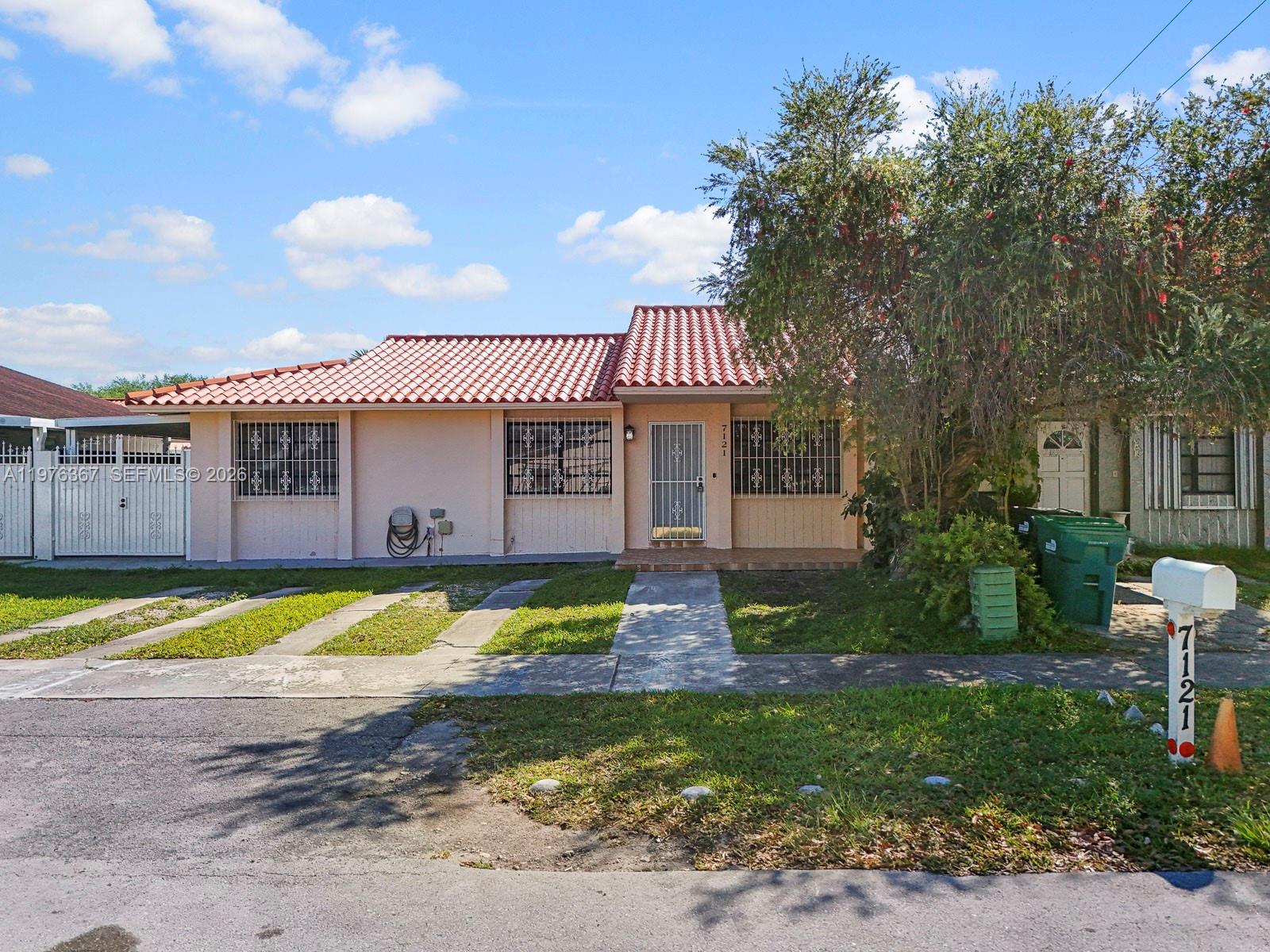 7121 Southwest 102nd Court Miami, FL 33173 - Photo 29 of 33 a view of a house with a swimming pool and a yard