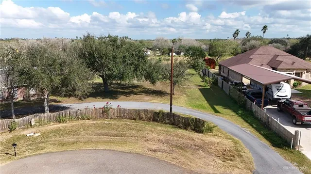 a view of a swimming pool with a yard