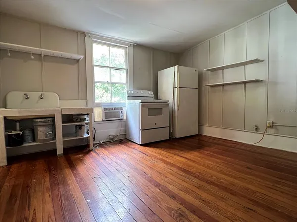 a kitchen with stainless steel appliances a stove and a refrigerator