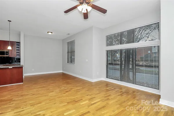 a view of kitchen and an empty room