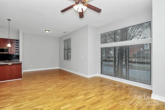 a view of kitchen and an empty room