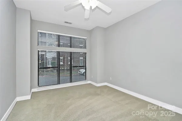 an empty room with a bathroom