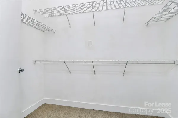 a bathroom with a toilet a sink and a mirror