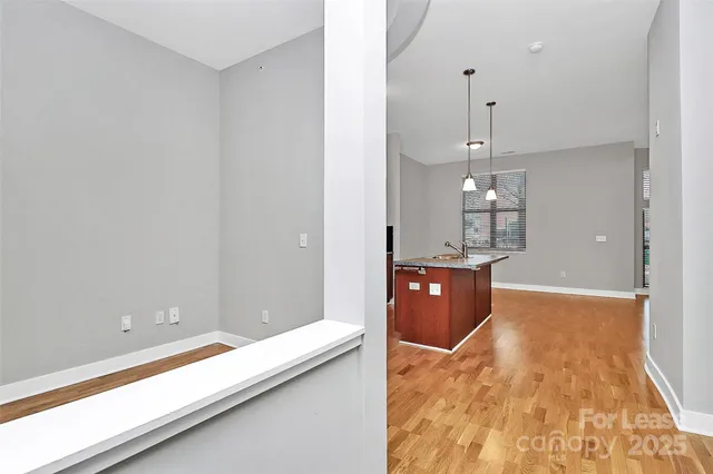 a view of a living room with kitchen island