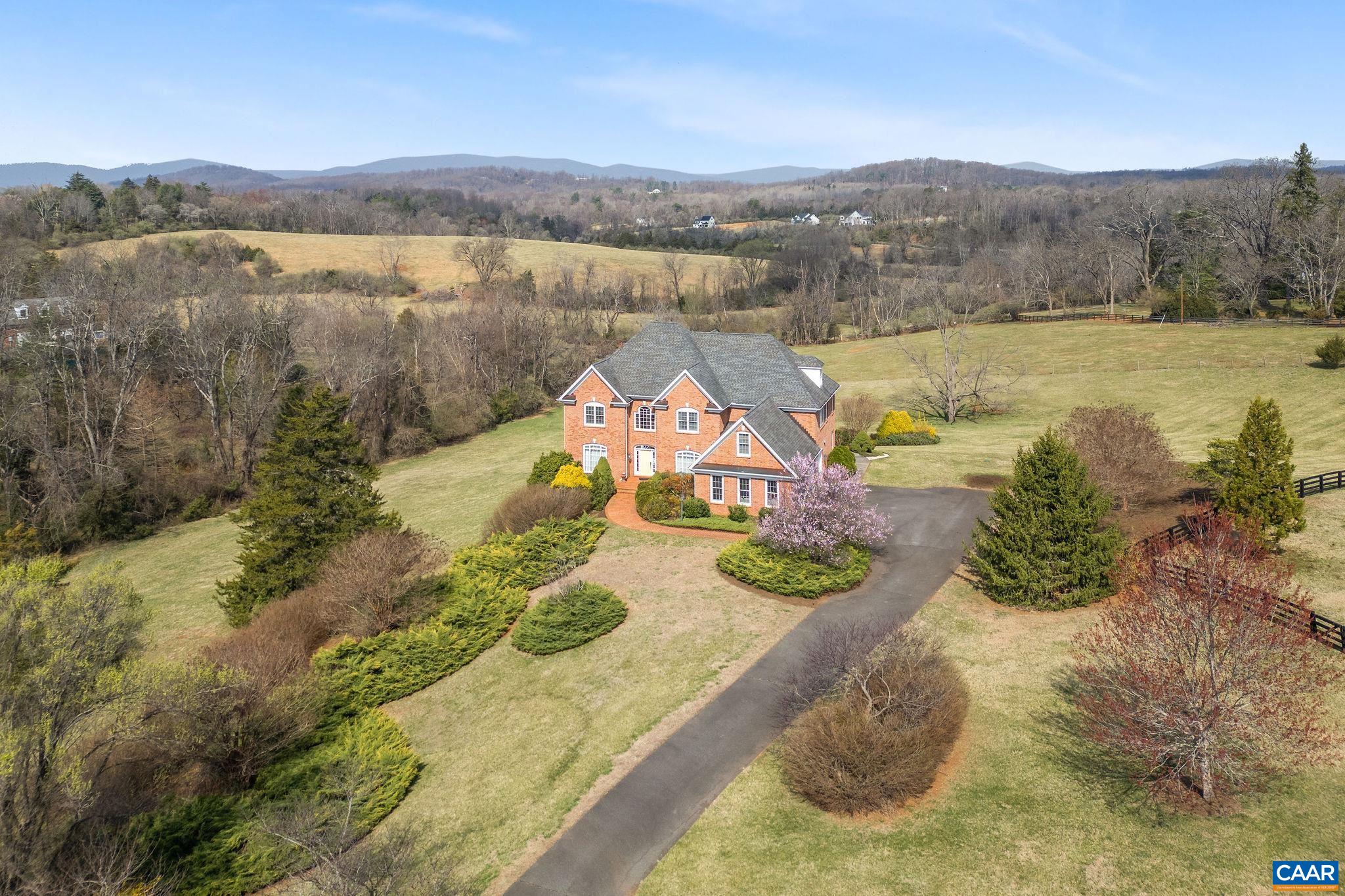 3160 Rocks Farm Court Charlottesville, VA 22903 - Photo 54 of 70 a view of a lake with couches and city view