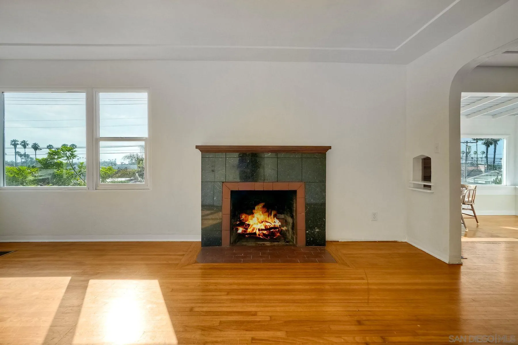 4692 Niagara Avenue San Diego, CA 92107 - Photo 12 of 62 a living room with a fireplace and a fireplace