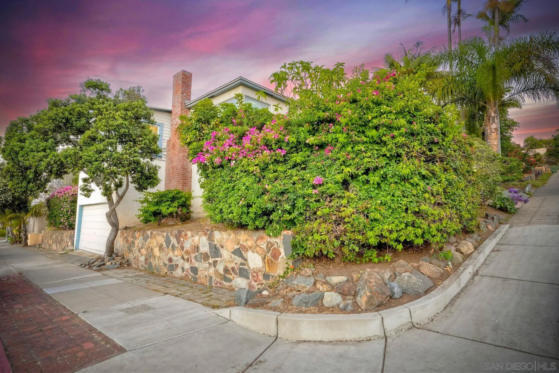 4692 Niagara Avenue San Diego, CA 92107 - Photo 41 of 62 a view of a garden with a fountain
