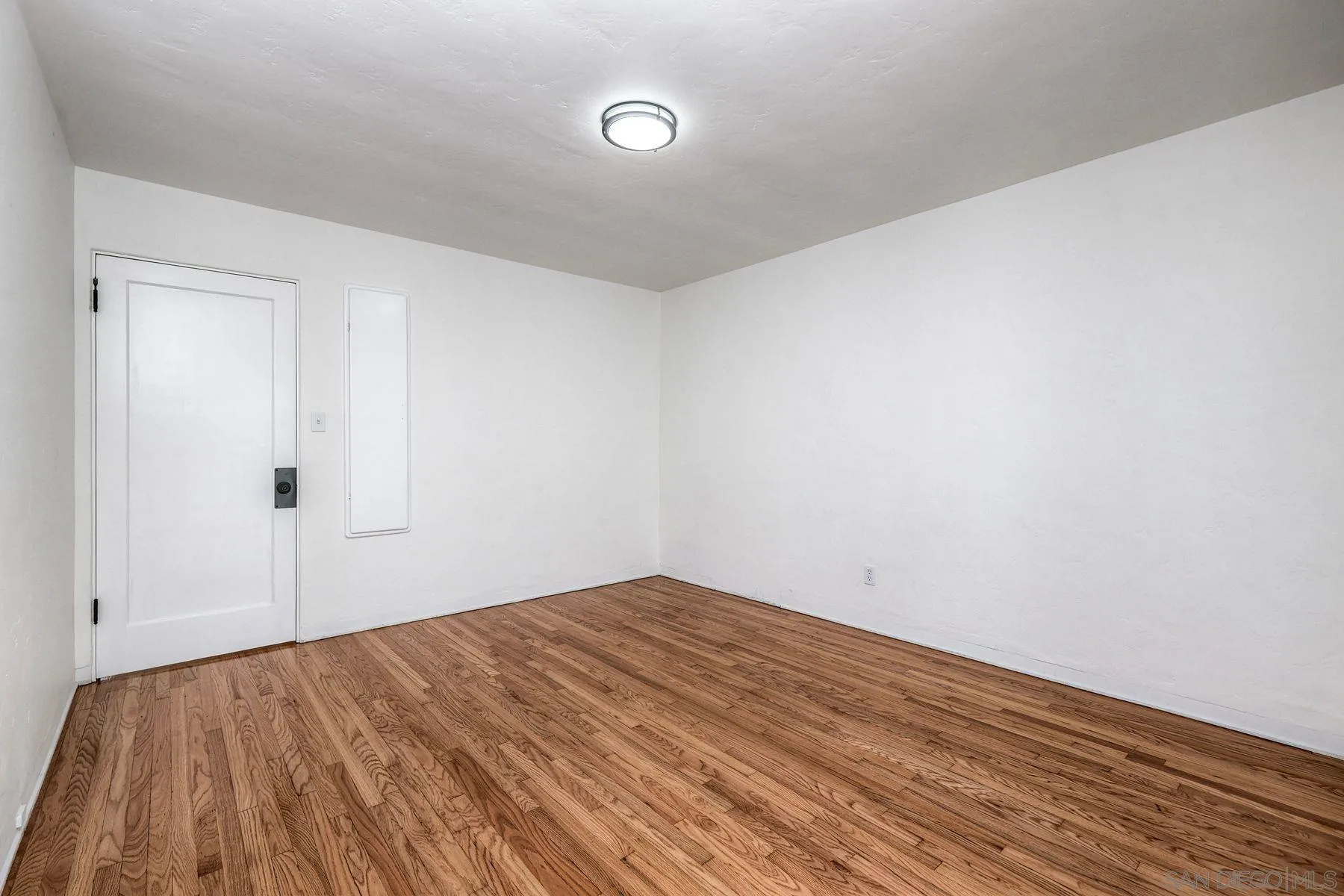 4692 Niagara Avenue San Diego, CA 92107 - Photo 51 of 62 a view of empty room with wooden floor