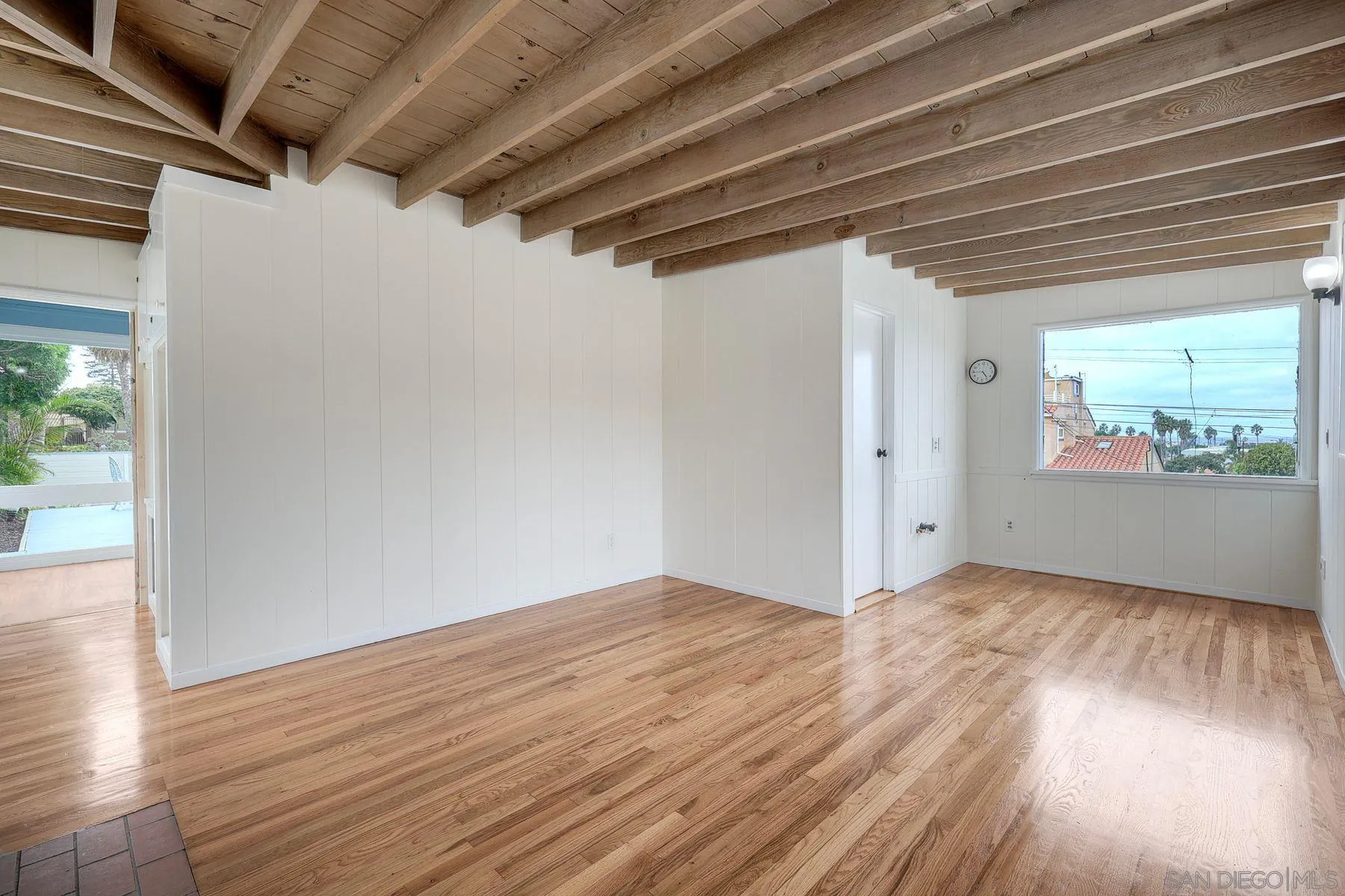 4692 Niagara Avenue San Diego, CA 92107 - Photo 53 of 62 a view of hallway with wooden floor