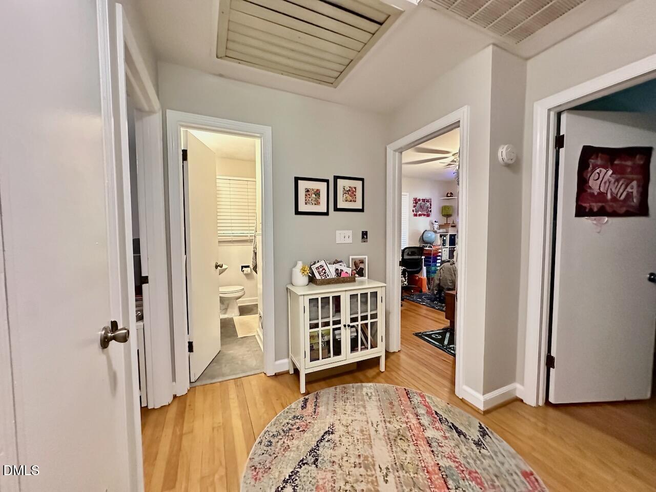 2813 Barmettler Street Raleigh, NC 27607 - Photo 13 of 22 a view of a bedroom with baby crib and cabinet