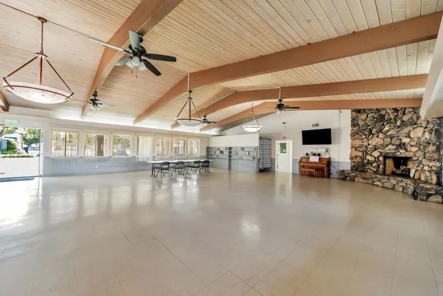 a room with furniture and wooden floor