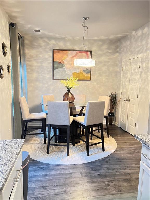 1775 Labonte Parkway McDonough, GA 30253 - Photo 5 of 20 a view of a dining room with furniture and wooden floor