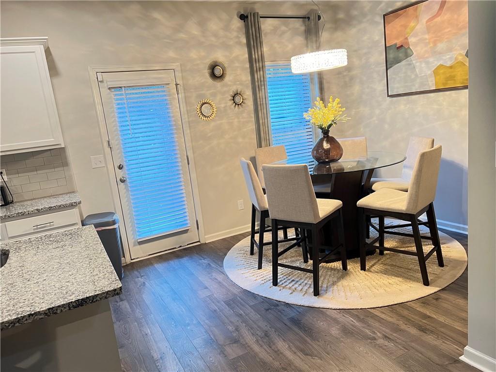 1775 Labonte Parkway McDonough, GA 30253 - Photo 7 of 20 a dining room with furniture and wooden floor