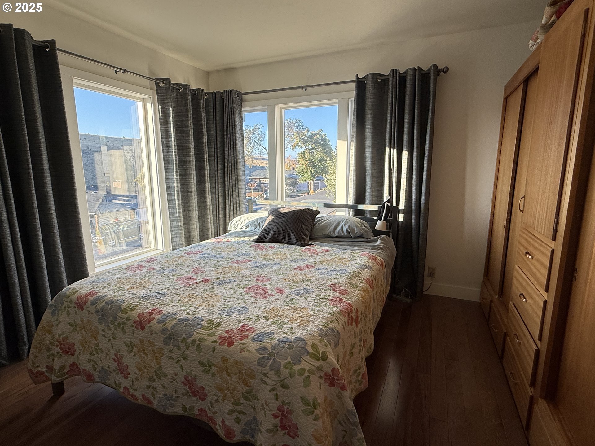 201 4th Street Maupin, OR 97037 - Photo 12 of 24 a bedroom with a bed and a large window