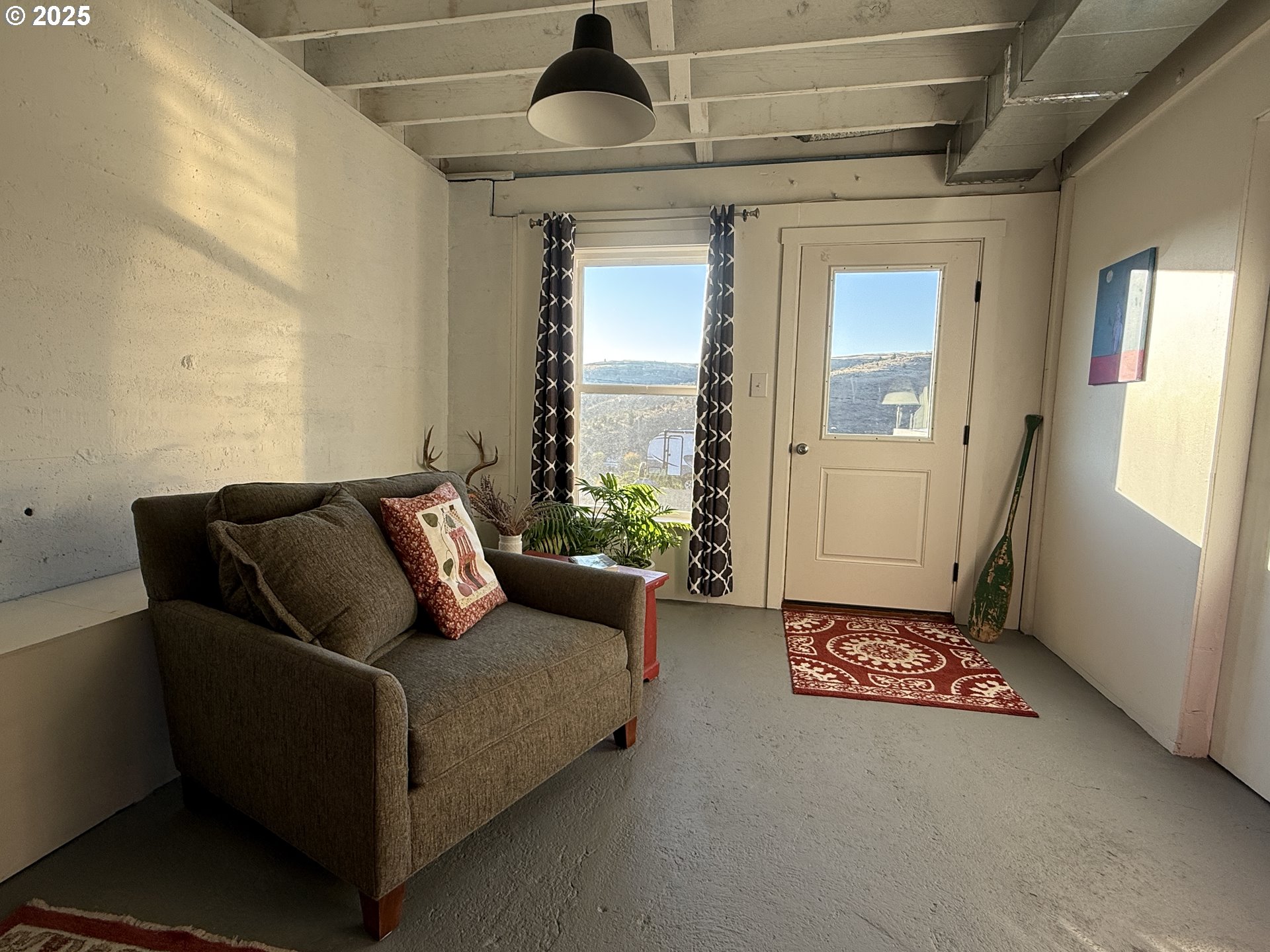 201 4th Street Maupin, OR 97037 - Photo 15 of 24 a living room with furniture and a gate