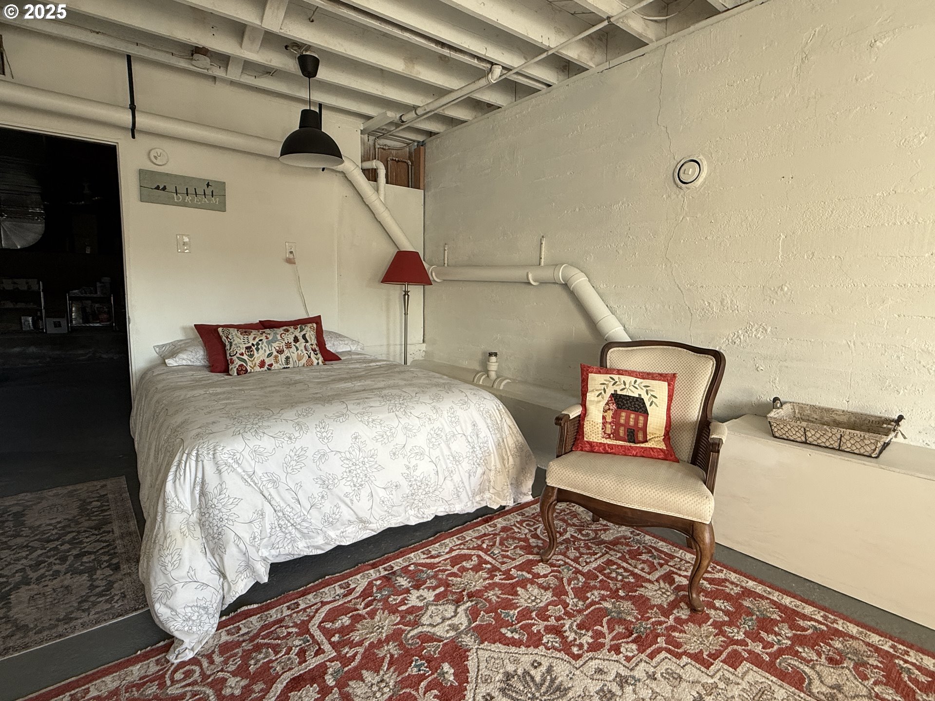 201 4th Street Maupin, OR 97037 - Photo 17 of 24 a bed room with a bed and a chair