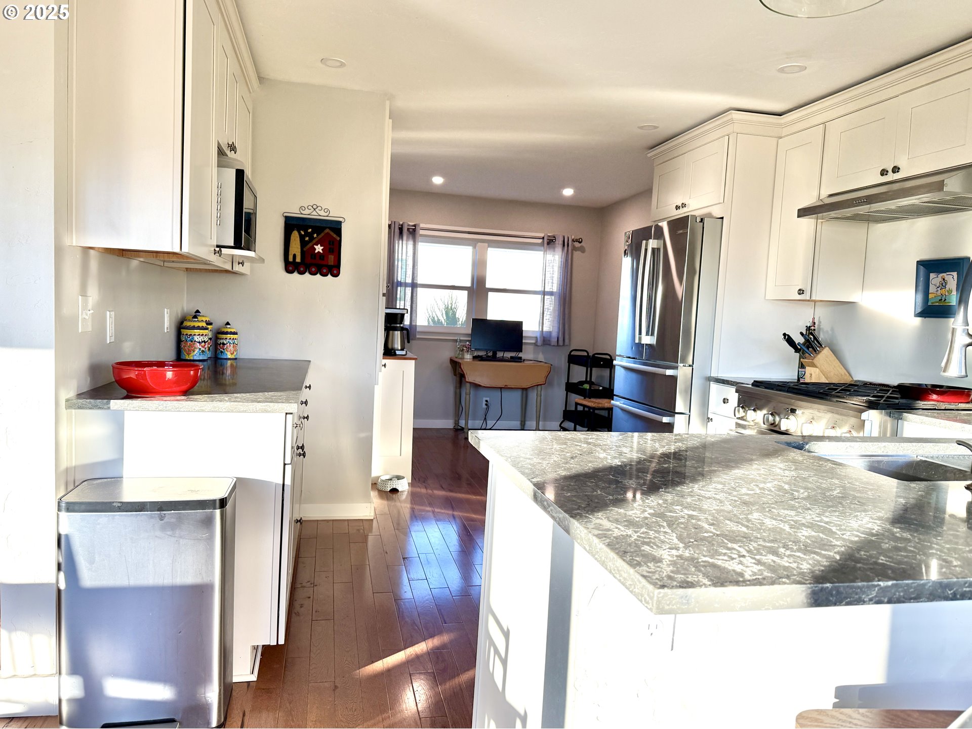 201 4th Street Maupin, OR 97037 - Photo 7 of 24 a kitchen with sink refrigerator and cabinets