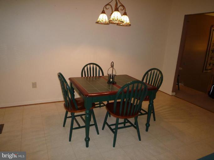 1749 Canal Run Drive Point of Rocks, MD 21777 - Photo 4 of 21 a view of a dining room with furniture and chandelier