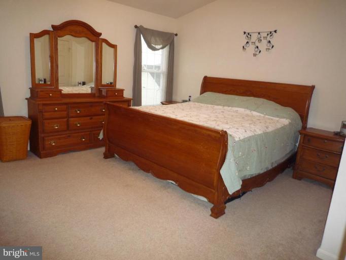 1749 Canal Run Drive Point of Rocks, MD 21777 - Photo 8 of 21 a bedroom with a bed and a dresser
