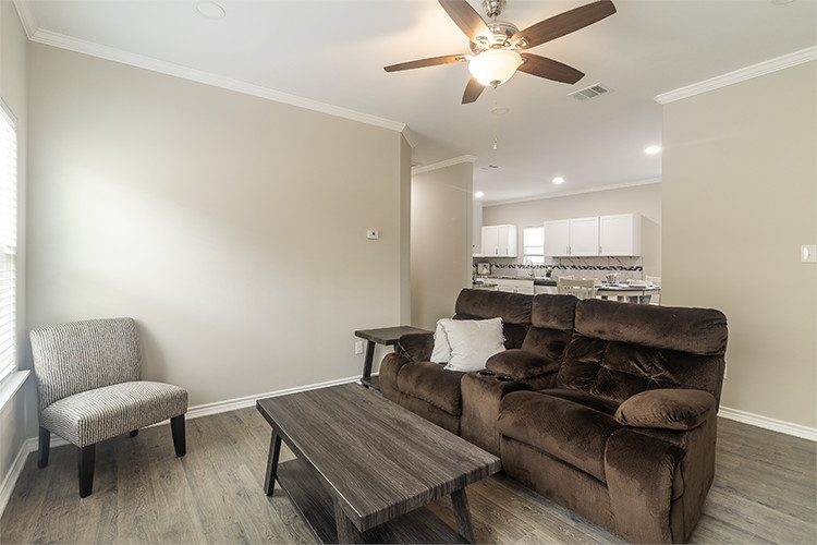 803 Hall Street Bryan, TX 77803 - Photo 2 of 11 a living room with furniture and a chair
