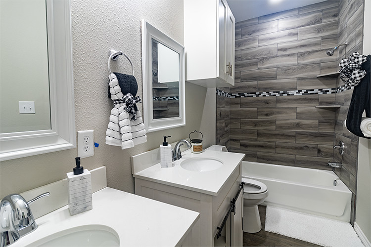 803 Hall Street Bryan, TX 77803 - Photo 9 of 11 a bathroom with a sink toilet and tub