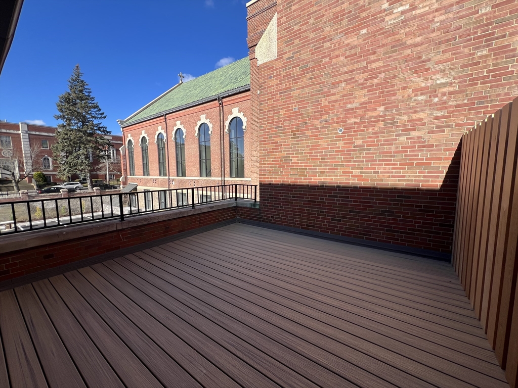 160 Seabury Street, Unit 10 Fall River, MA 02720 - Photo 2 of 11 a view of balcony with wooden floor