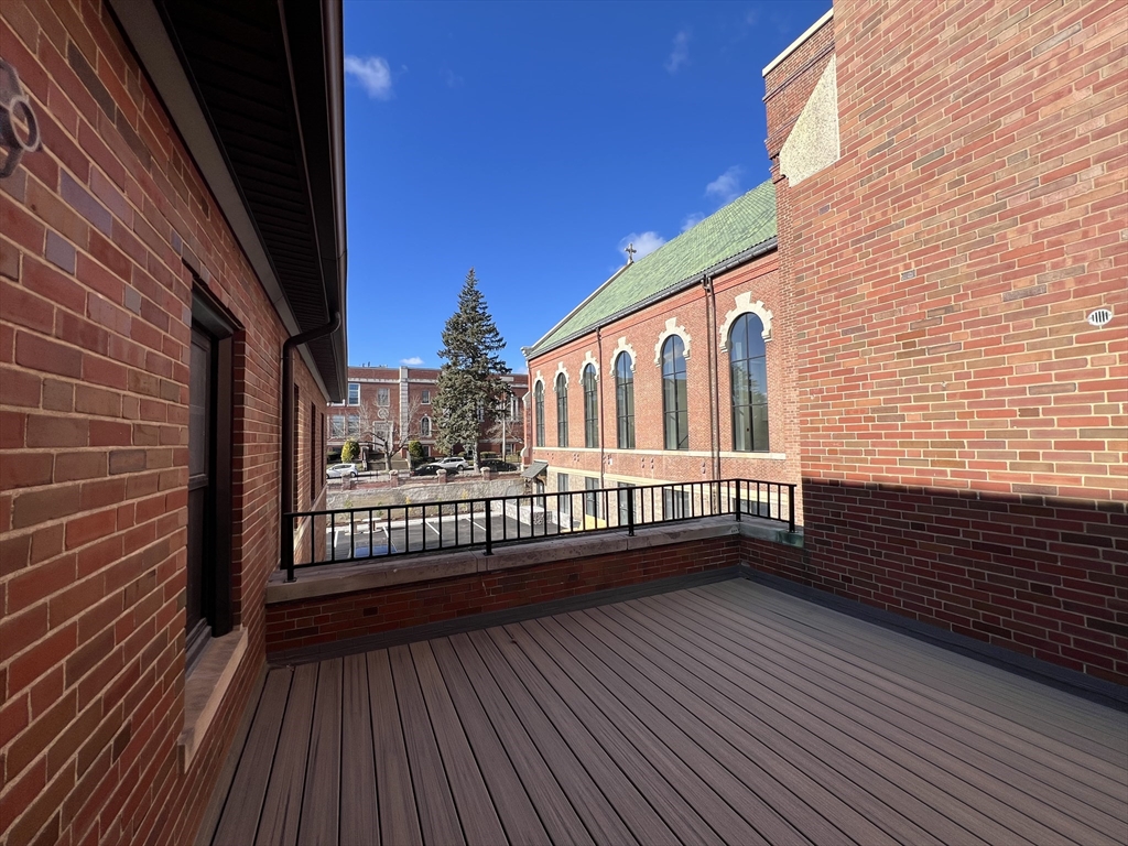 160 Seabury Street, Unit 10 Fall River, MA 02720 - Photo 4 of 11 a view of balcony with wooden floor