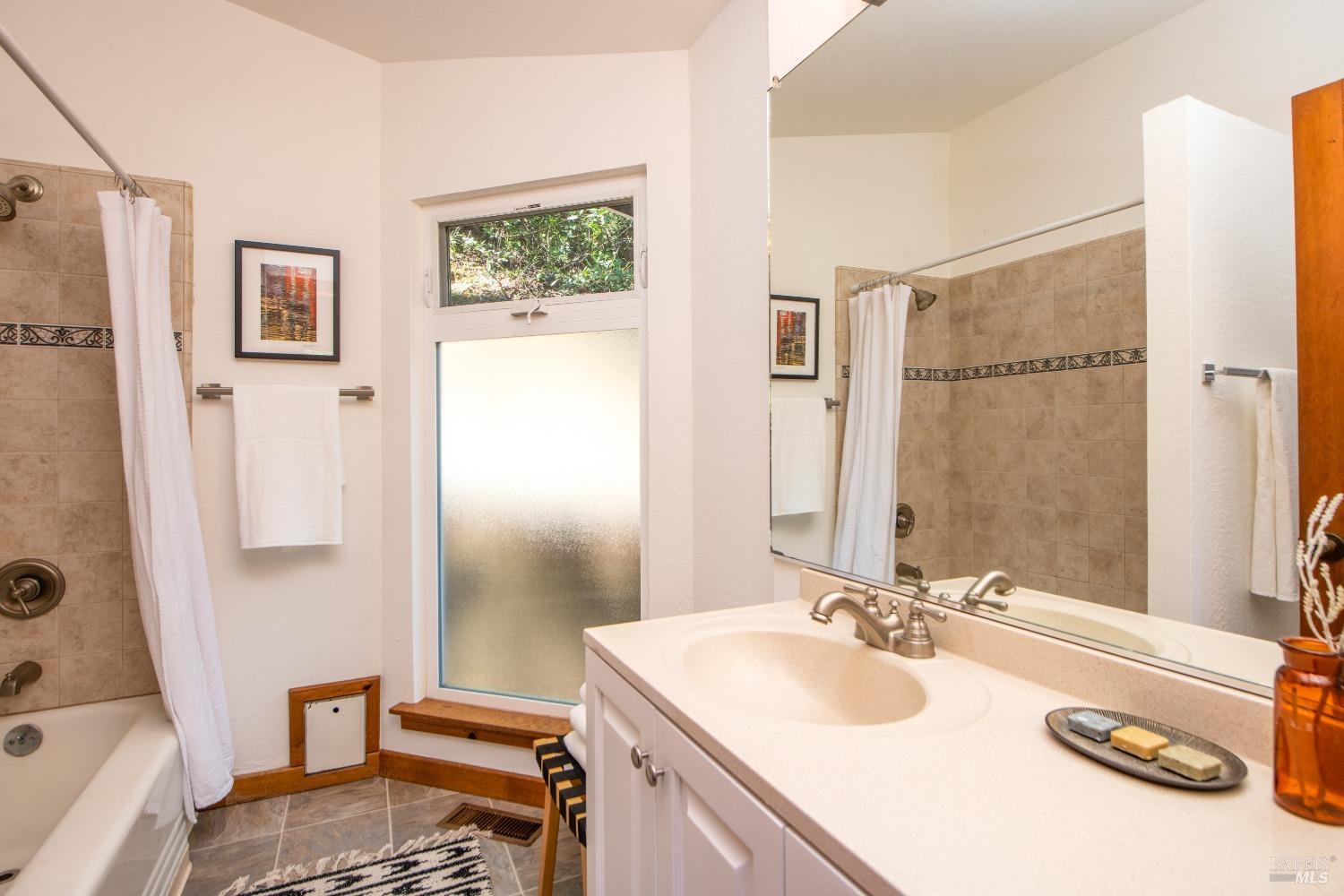 251 West End Avenue San Rafael, CA 94901 - Photo 17 of 35 a bathroom with a sink double vanity and a mirror
