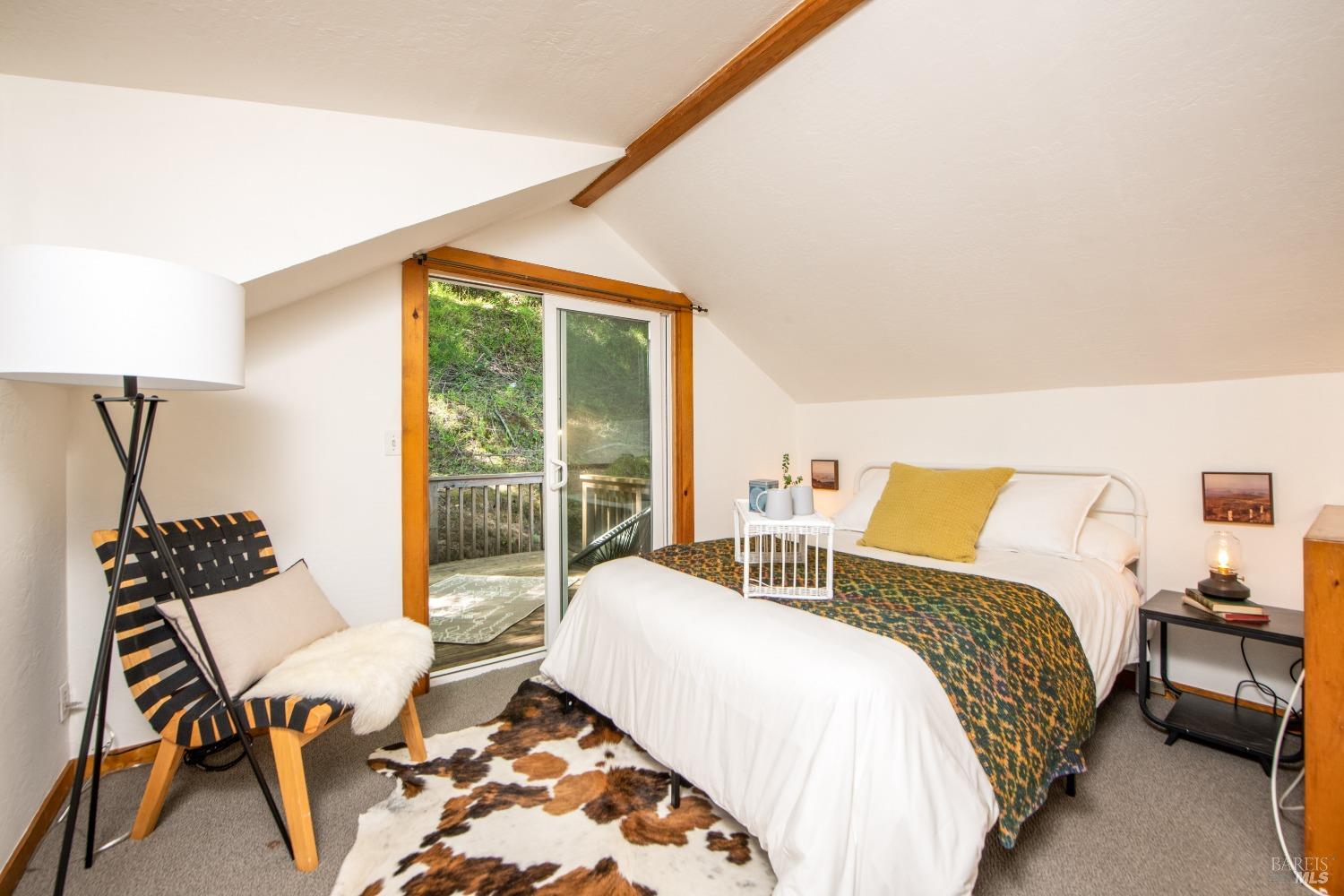 251 West End Avenue San Rafael, CA 94901 - Photo 19 of 35 a bedroom with a bed and wooden floor