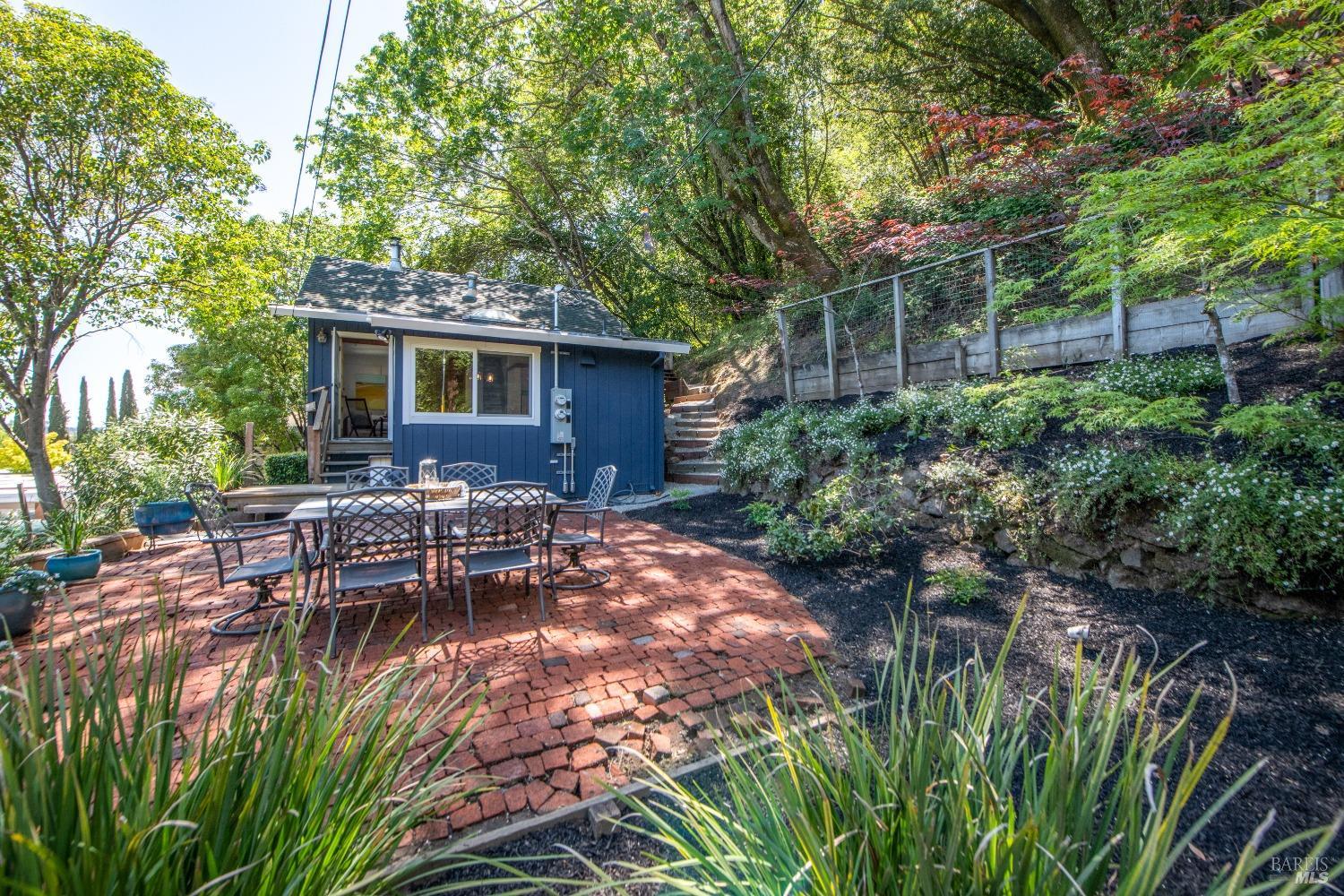 251 West End Avenue San Rafael, CA 94901 - Photo 2 of 35 a view of a backyard with table and chairs potted plants and large tree