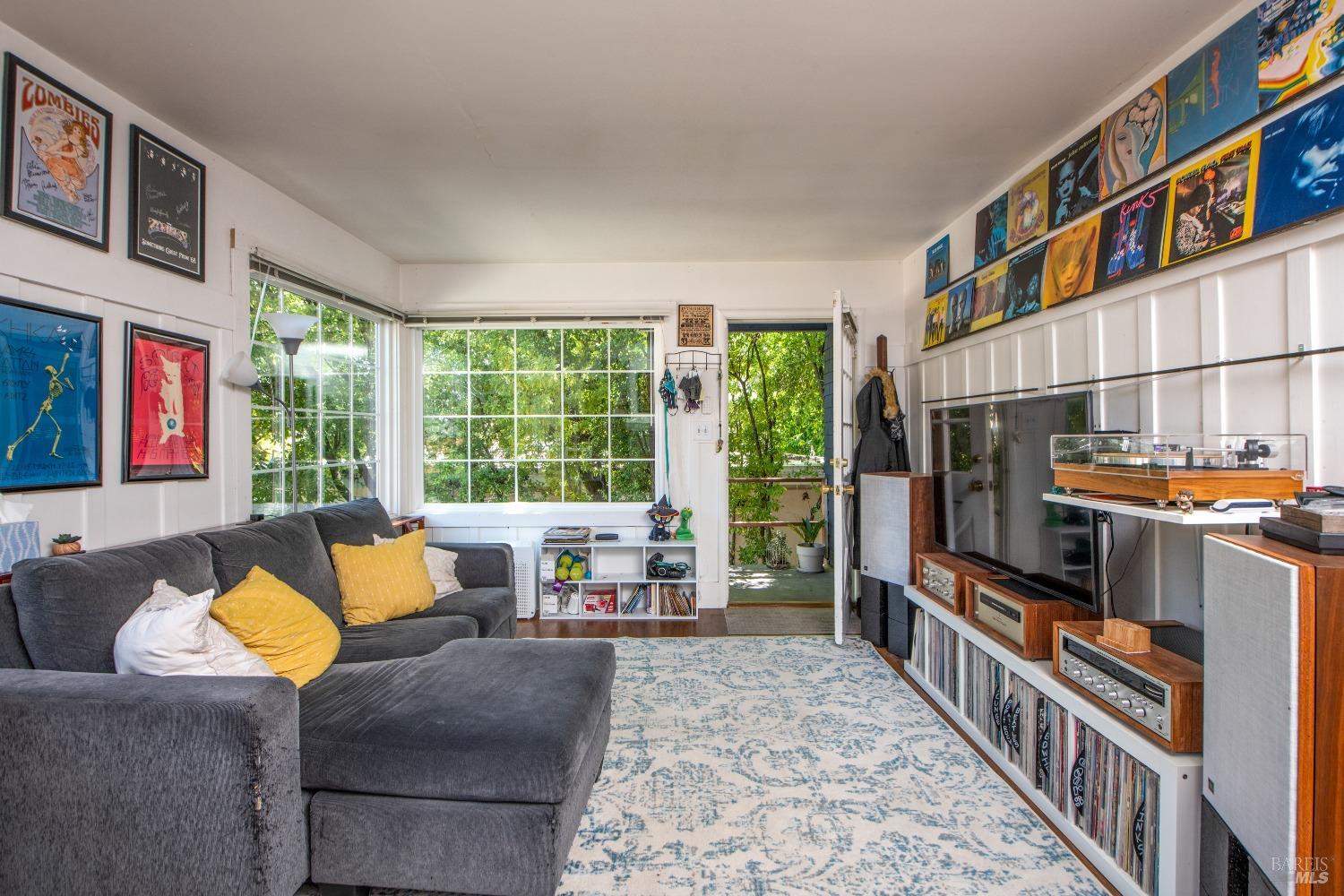 251 West End Avenue San Rafael, CA 94901 - Photo 23 of 35 a living room with furniture and a flat screen tv