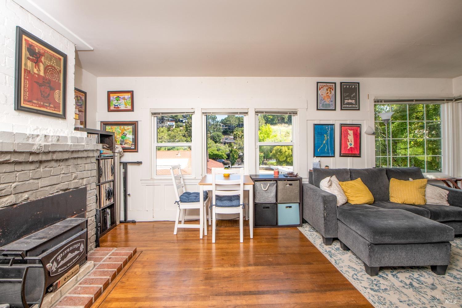 251 West End Avenue San Rafael, CA 94901 - Photo 25 of 35 a living room with furniture wooden floor and a fireplace