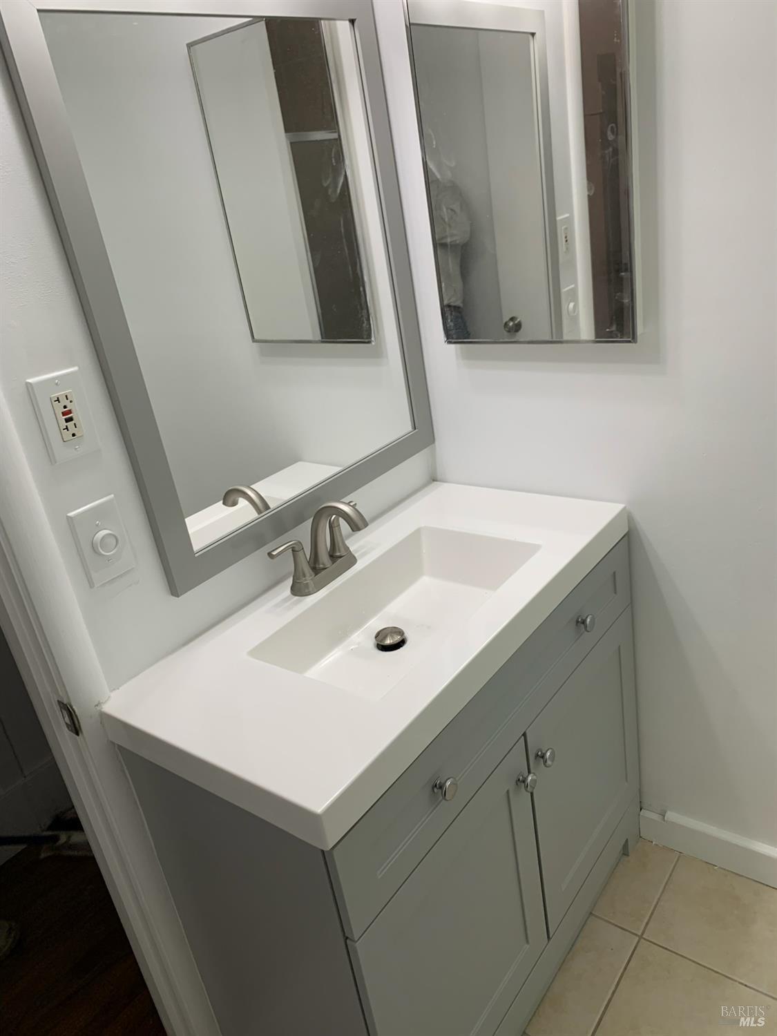 251 West End Avenue San Rafael, CA 94901 - Photo 27 of 35 a bathroom with a sink and a mirror
