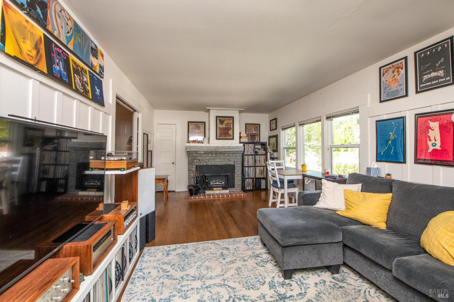 251 West End Avenue San Rafael, CA 94901 - Photo 3 of 35 a living room with furniture and a fireplace