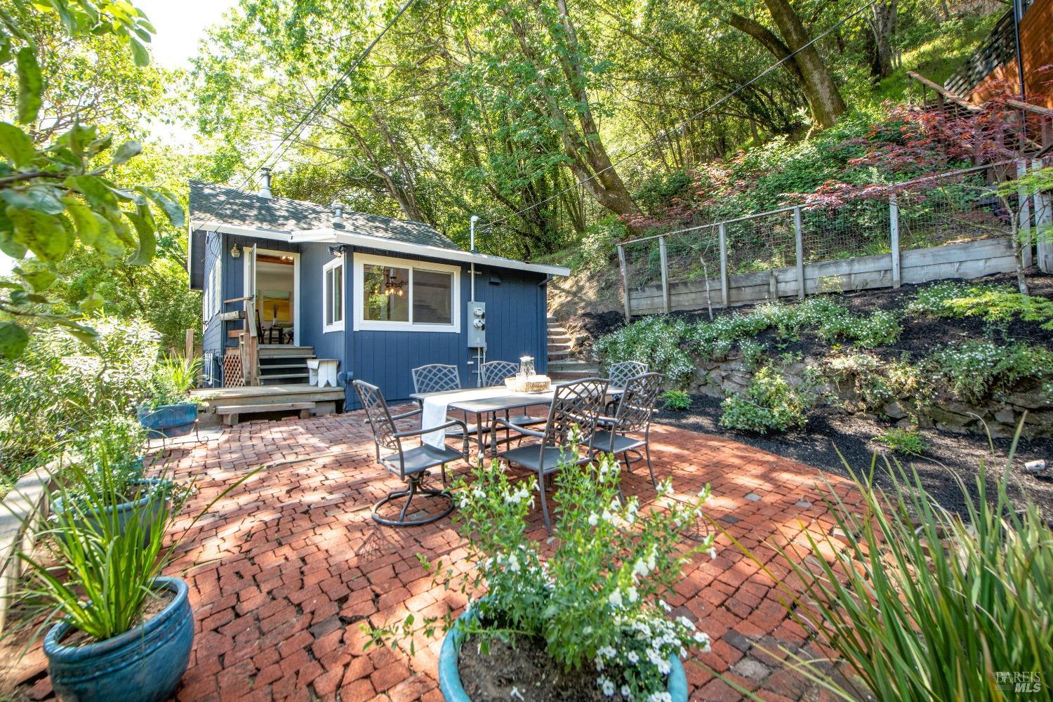 251 West End Avenue San Rafael, CA 94901 - Photo 4 of 35 a backyard of a house with yard and outdoor seating