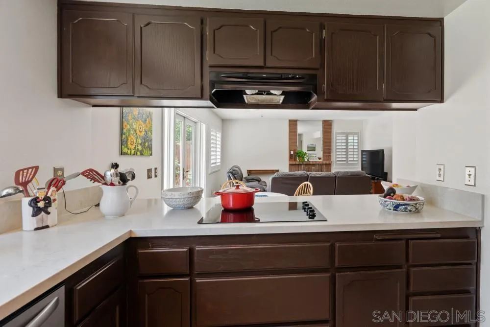13227 Treecrest Street Poway, CA 92064 - Photo 12 of 32 a kitchen with a sink cabinets and window