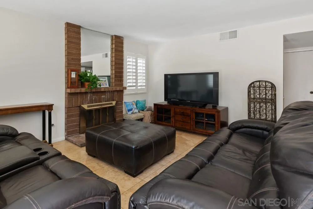13227 Treecrest Street Poway, CA 92064 - Photo 14 of 32 a living room with furniture and a flat screen tv