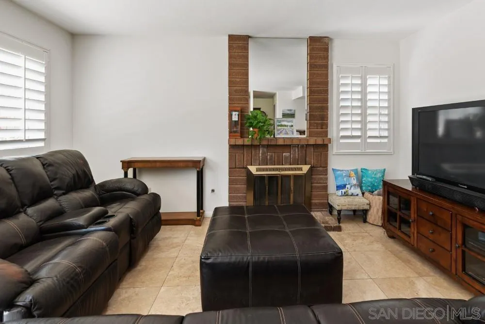 13227 Treecrest Street Poway, CA 92064 - Photo 15 of 32 a living room with furniture and a flat screen tv