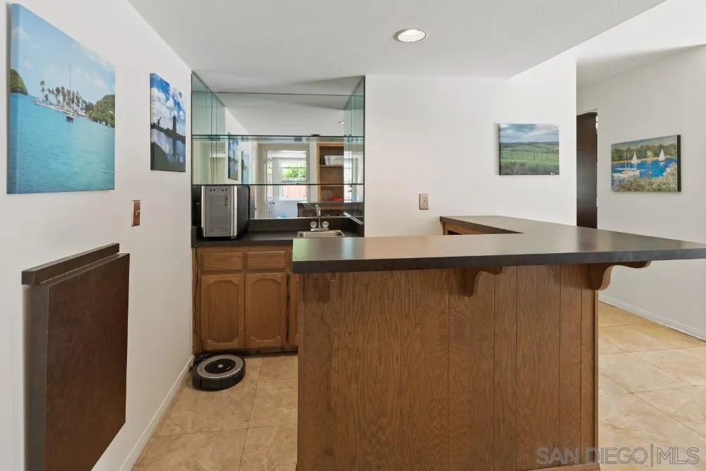 13227 Treecrest Street Poway, CA 92064 - Photo 16 of 32 a room with a table and chairs