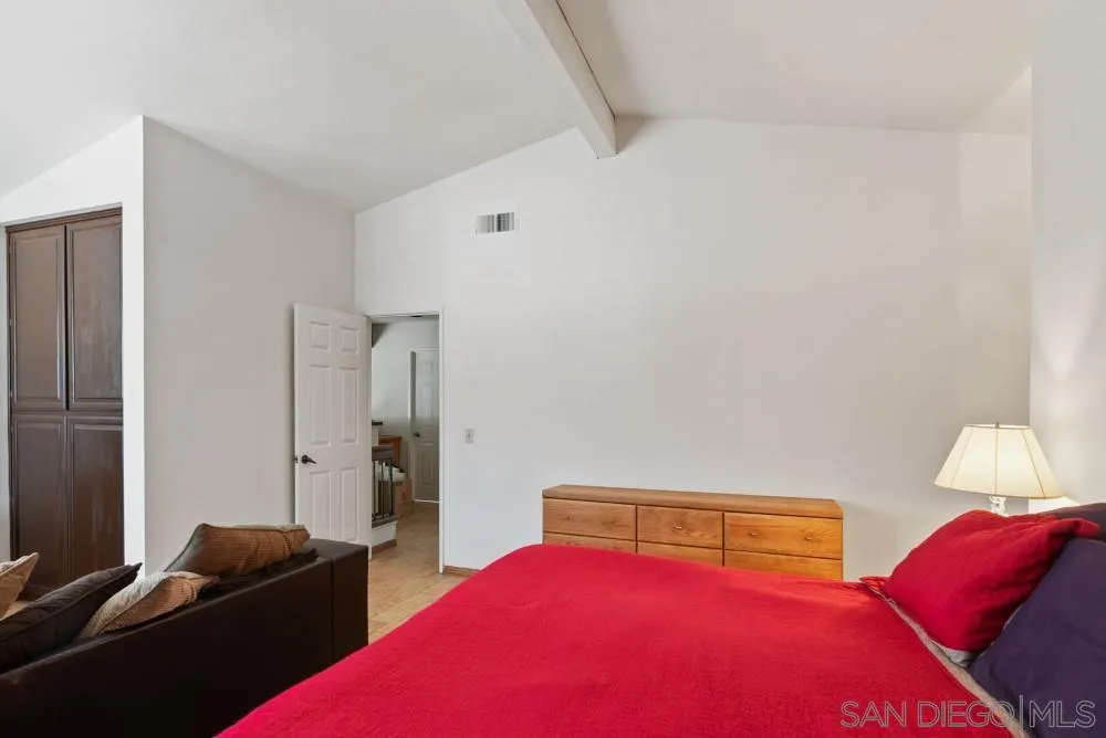 13227 Treecrest Street Poway, CA 92064 - Photo 19 of 32 a bedroom with a bed and a couch