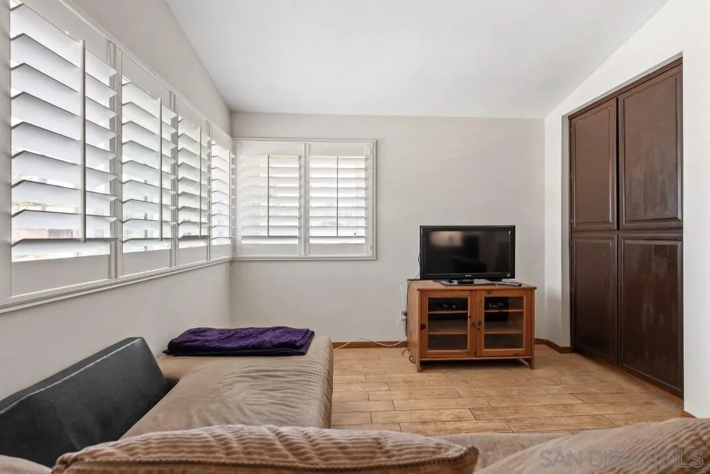 13227 Treecrest Street Poway, CA 92064 - Photo 20 of 32 a living room with furniture and flat screen tv